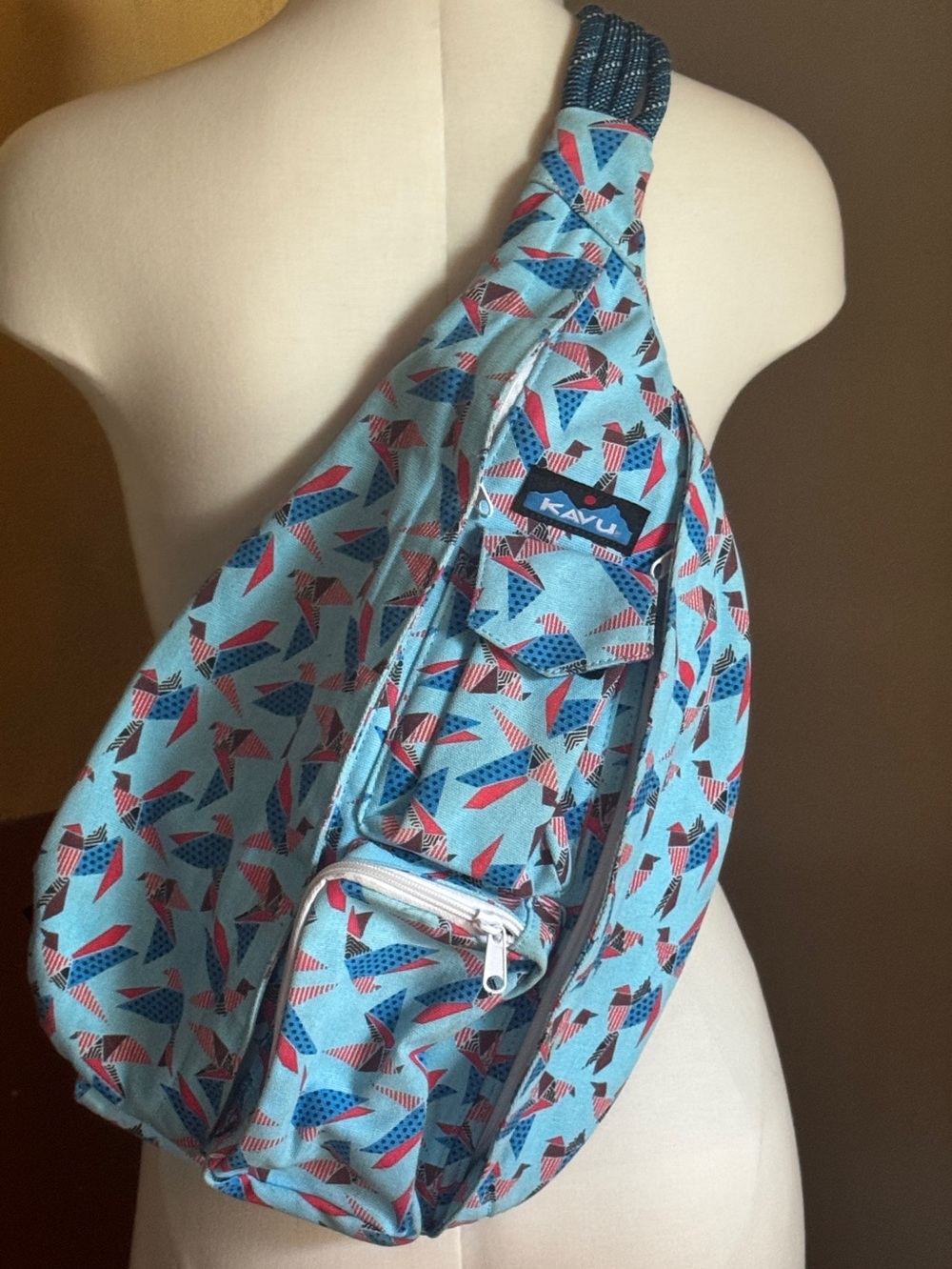 Kavu Light Blue Patterned Sling Bag with Red and Navy Accents